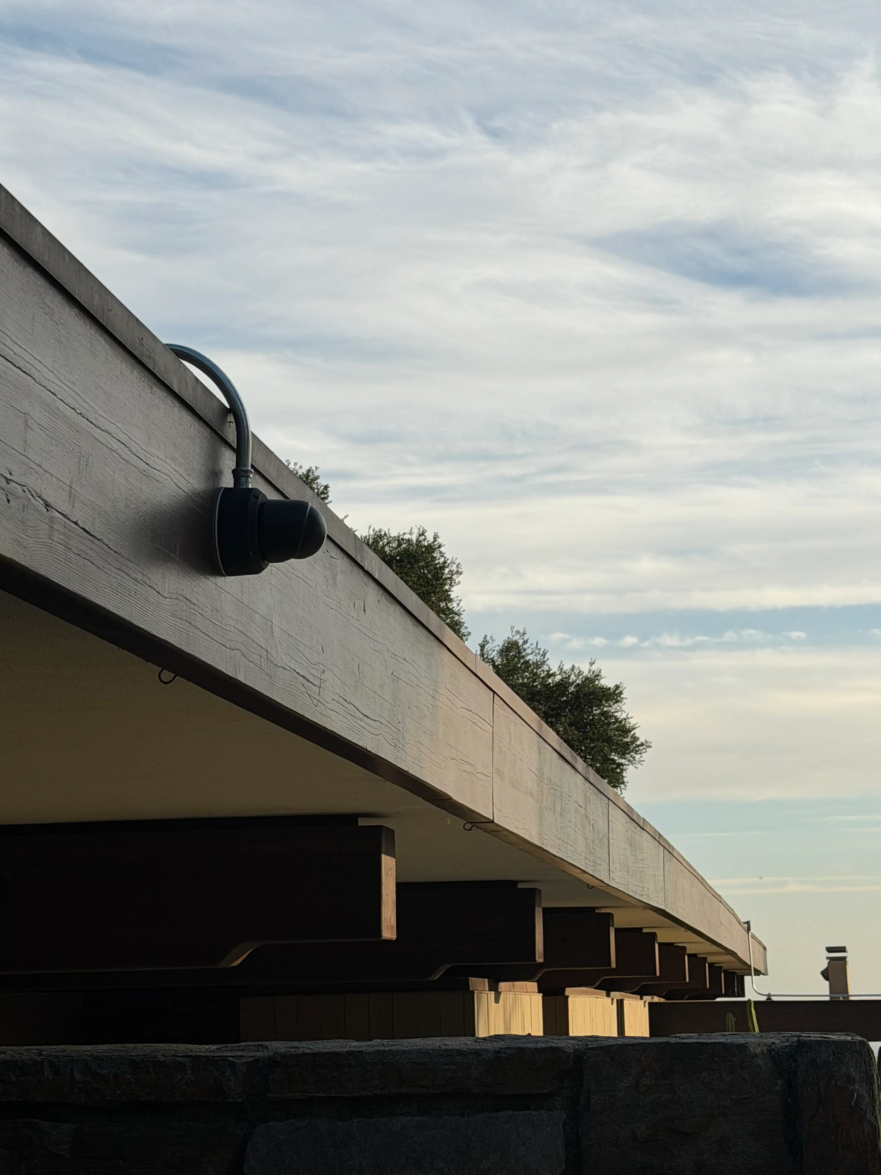 Ubiquiti G6 Turret camera installed under a roof eave